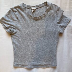 Grey baby tee in size s but fits xs.